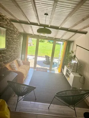 a living room with a couch and a table at Carballo Alenza,2 in Castro Caldelas