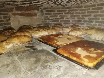 a group of breads and pastries sitting on a counter at Pajar in Braña