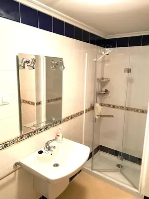 a bathroom with a sink and a shower at Barreiros Playa Altar in Barreiros