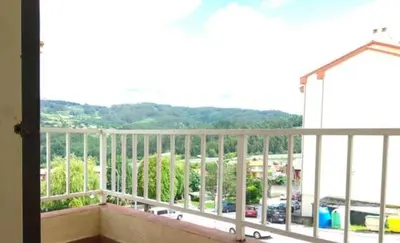 a balcony with a view of a parking lot at Amplio piso en Pontedeume in Puentedeume