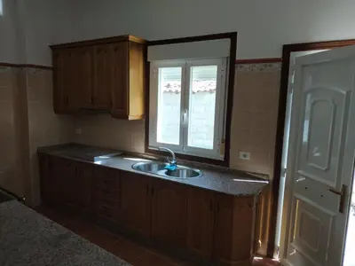 a kitchen with a sink and a window at Casa Xarreiro in Chantada