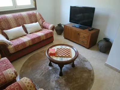 a living room with a couch and a table at Casa Xarreiro in Chantada