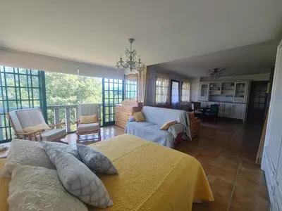 a bedroom with a bed and a living room at Castelodobispo - Ourense in Sobrado del Obispo