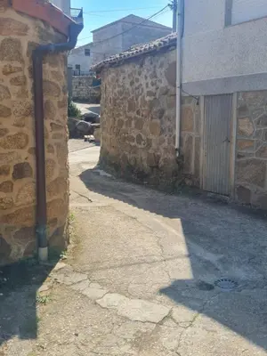 a stone building with a door on the side of it at Castelodobispo - Ourense in Sobrado del Obispo
