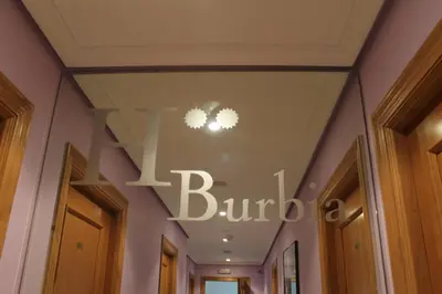 a sign on the ceiling of a building at Hostal Burbia in Villafranca del Bierzo