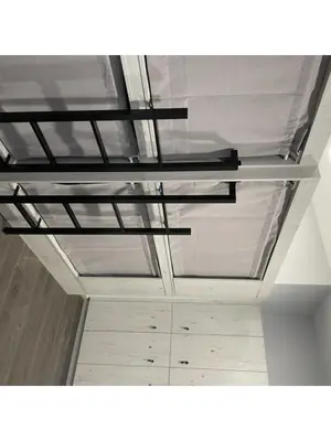 a ceiling in a room with a room with cabinets at Albergue a Carballeira in Villalba