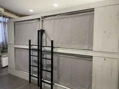a wall with curtains on it in a room at Albergue a Carballeira in Villalba