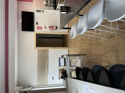 a room with white pans hanging on a wall at Albergue a Carballeira in Villalba