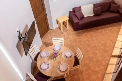 an overhead view of a table with chairs and a couch at Pallozas Turísticas Ridicodias - A Vieira in Laza