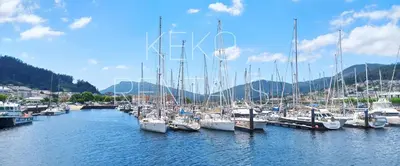 a bunch of boats docked in a harbor at Sobre la Ría in Viveiro