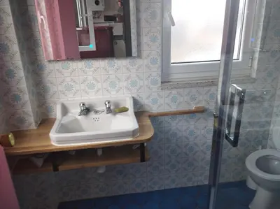 a bathroom with a sink and a toilet at Vivienda A Travesía Dos Soños in Sarria