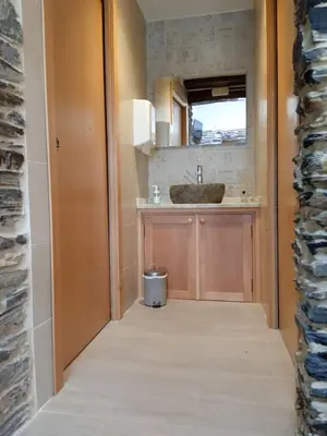 a small kitchen with a sink and a counter at O Lar do Alecrín in Friol