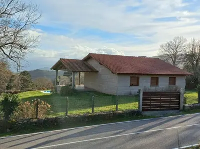 a small house on the side of a road at Lobetios - Casa rural in Parada de Achas
