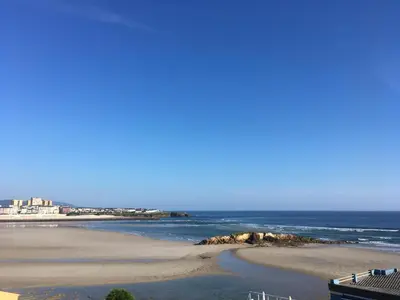 a view of a beach with the ocean at Apartamento con hermosas vistas a la playa del Altar in Sieiro