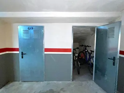 a room with two doors and a bike in it at Estudio céntrico 1 con terraza y parking privado in Ourense