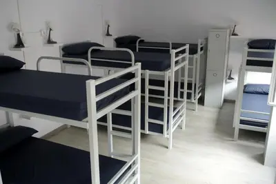 a group of bunk beds in a room at Albergue Trabazo in Silleda