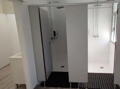 a corridor with a glass door in a room at Albergue Trabazo in Silleda