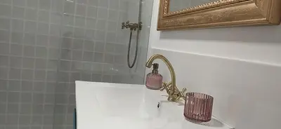 a bathroom with a sink and a mirror at Casiña d'afreita in Rinlo