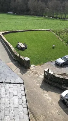 an aerial view of a park with cars in a field at Pension Casa Simon in Tríacastela
