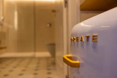 a bathroom with a toilet with the word hate on it at De la Osa Hotel in Abres
