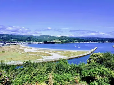a view of a river with boats in the water at The Cliffs - Mansión del Indiano I in Viveiro