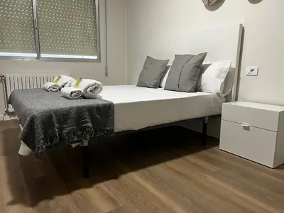 a bedroom with a bed with a blanket on it at Oktheway Ultreia in Sarria