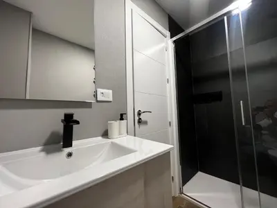 a bathroom with a sink and a shower at Oktheway Ultreia in Sarria