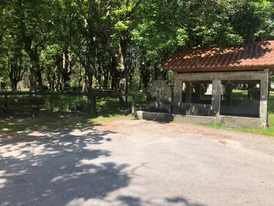 a building in a park with a lot of trees at As Pias in Pontevedra