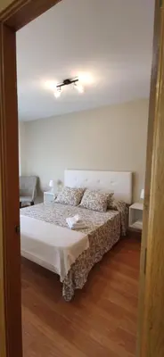 a bedroom with a large bed in a room at La morada del Museo in Ponferrada