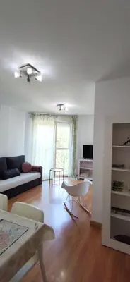 a living room with a couch and a table at La morada del Museo in Ponferrada
