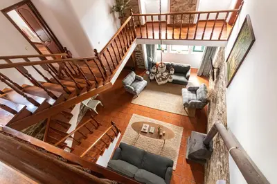 an overhead view of a living room with a staircase at Casa das Regueiras in Santiago de Compostela