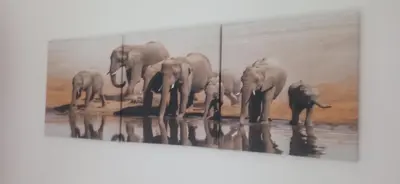 a painting of a herd of elephants drinking water at DÚPLEX ÁTICO XANA FOZ con terraza 80 m2 privada y vistas a la ría in Foz