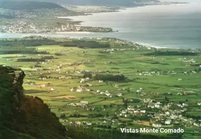 an aerial view of a town on a hill next to the ocean at DÚPLEX ÁTICO XANA FOZ con terraza 80 m2 privada y vistas a la ría in Foz