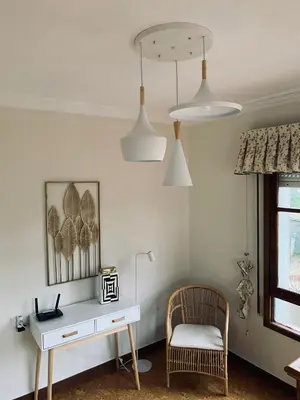 a room with a desk and a chair and lights at Casa en Cambeo in Ourense