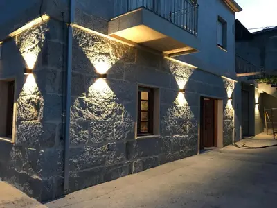 a building with lights on the side of it at Casa en Cambeo in Ourense