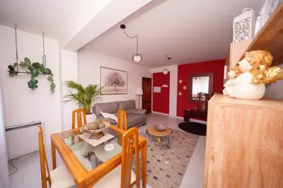a living room with a table and a couch at Antoxos Sacra Home I in Chantada
