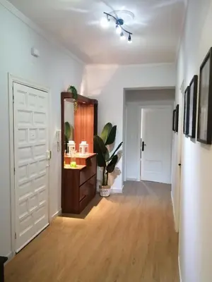 an empty hallway with a door and a potted plant at Quiroga centro paradise in Quiroga