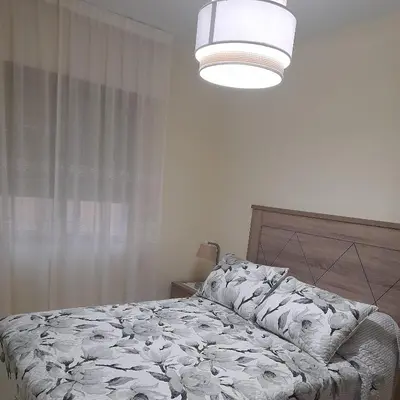 a bedroom with a bed and a light at Aloha Barreiros in Barreiros
