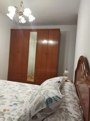 a bedroom with a bed with a dresser and a mirror at Aloha Barreiros in Barreiros