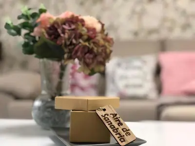 a price tag on a table next to a vase of flowers at Aire de Sanabria Puebla in Puebla de Sanabria
