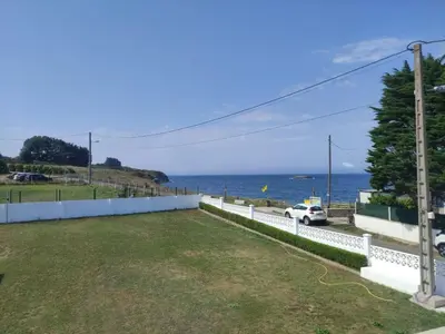 a view of the ocean from the patio of a house at POLAS BEACH LOFT in Nois