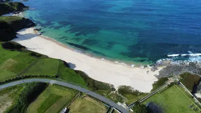an aerial view of a beach and the ocean at POLAS BEACH LOFT in Nois