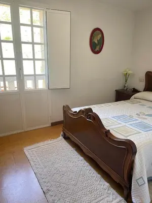 a bedroom with a bed and a window at Casa do Cuco, Ribeira Sacra in Ourense