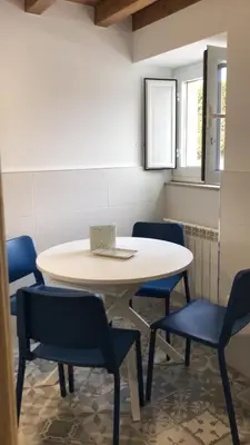 a table and chairs in a room with a table at Casa Cea in Melide