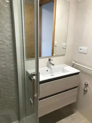 a bathroom with a sink and a mirror at Casa Cea in Melide
