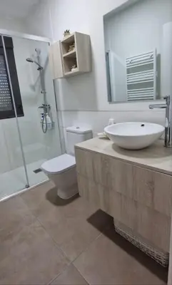 a bathroom with a sink and a toilet and a shower at Casa da Penela in Nogueira de Ramuin