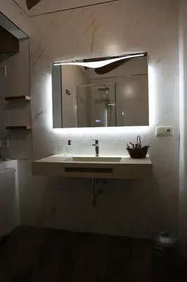 a bathroom with a sink and a mirror at Casa Os Prados da Albela in Tríacastela