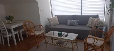 a living room with a couch and chairs and a table at ÁTICO 2 terrazas LEMASALUD in Ares
