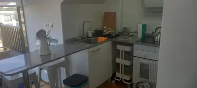 a kitchen with a sink and a counter top at ÁTICO 2 terrazas LEMASALUD in Ares