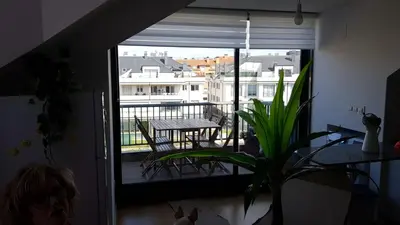 a room with a balcony with a table and chairs at ÁTICO 2 terrazas LEMASALUD in Ares